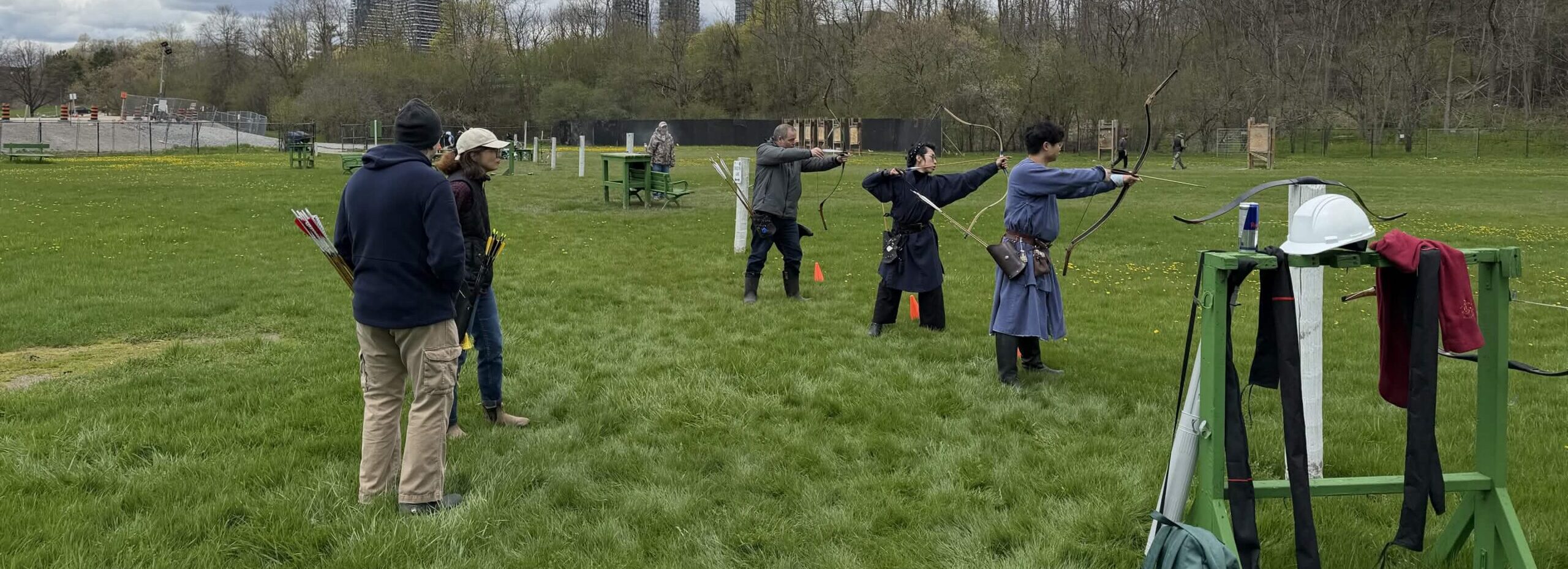 Asiatic archers practicing archery in a park in the GTA.